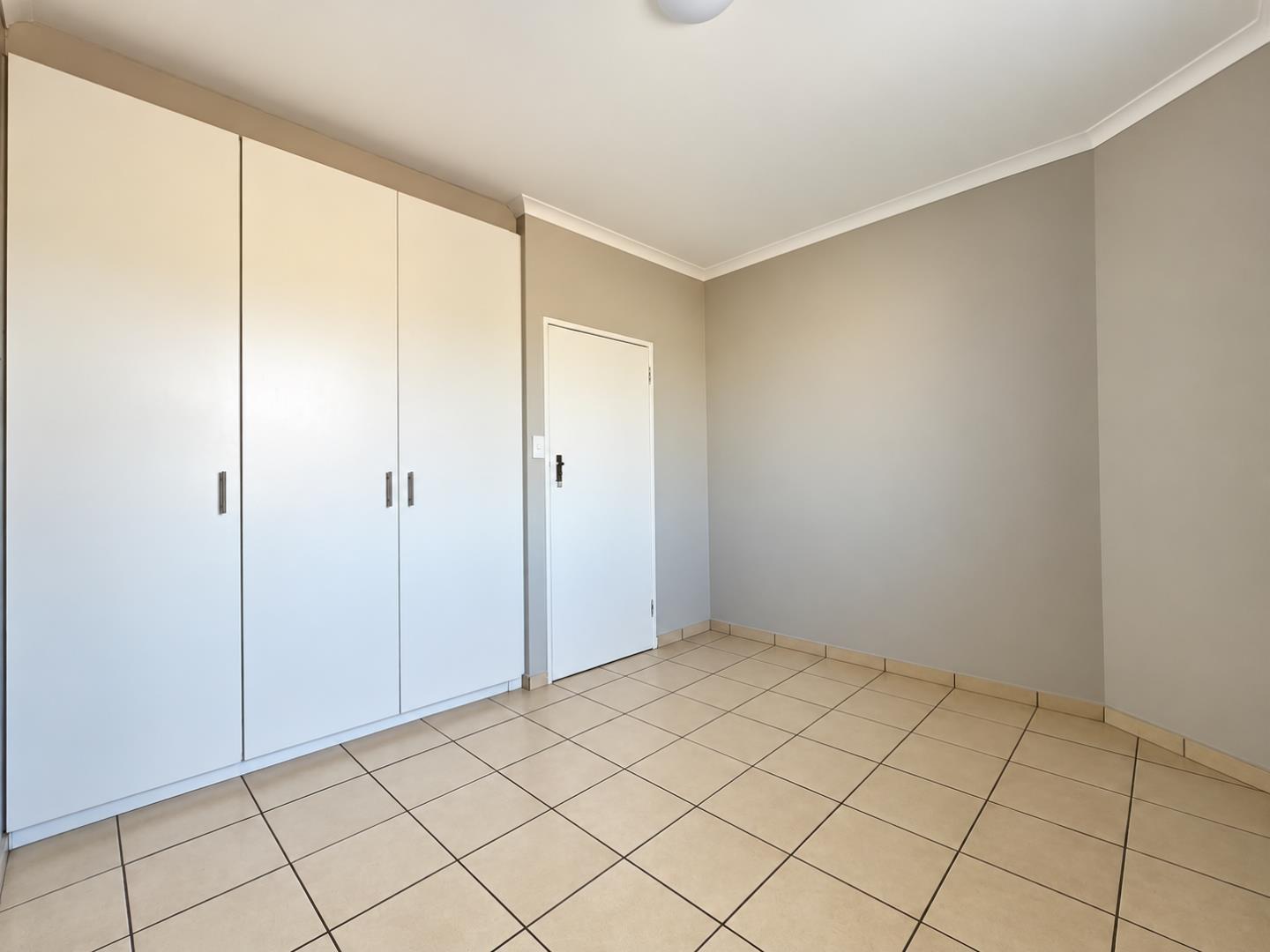 769655_Minimal_Greige_Room_with_Built-In_Wardrobe.png