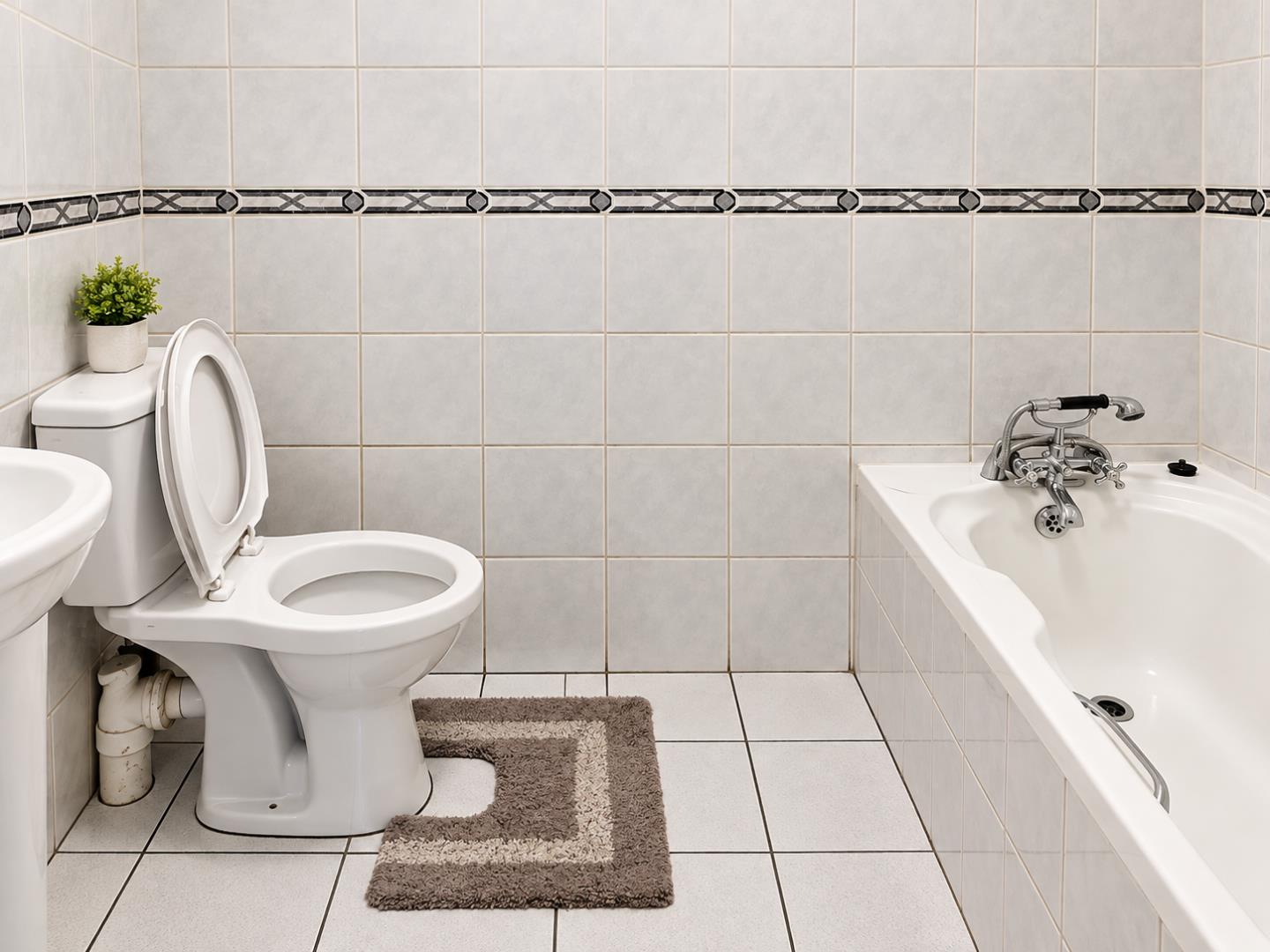769695_Bright_Minimalist_Bathroom_with_Open_Toilet_and_Bathtub.png