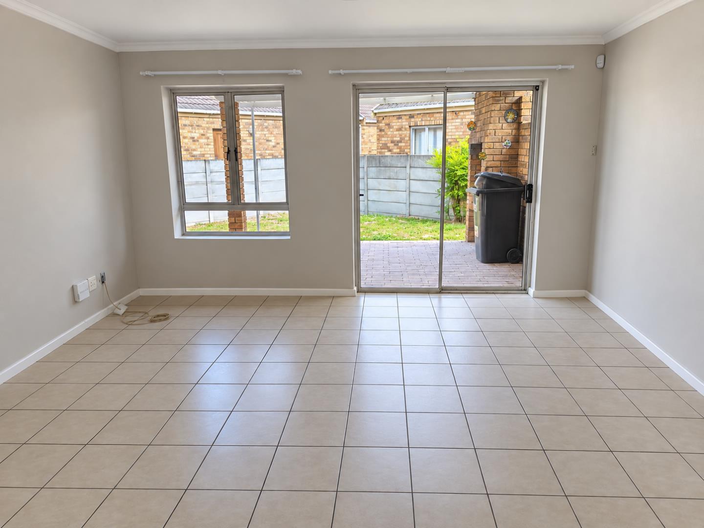 769788_Bright_Empty_Living_Room_with_Patio_Views.png