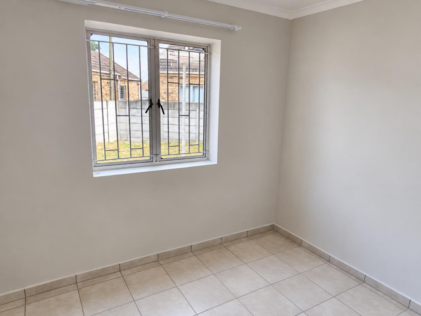 769788_Minimalist_Daylit_Room_with_Grilled_Window.png