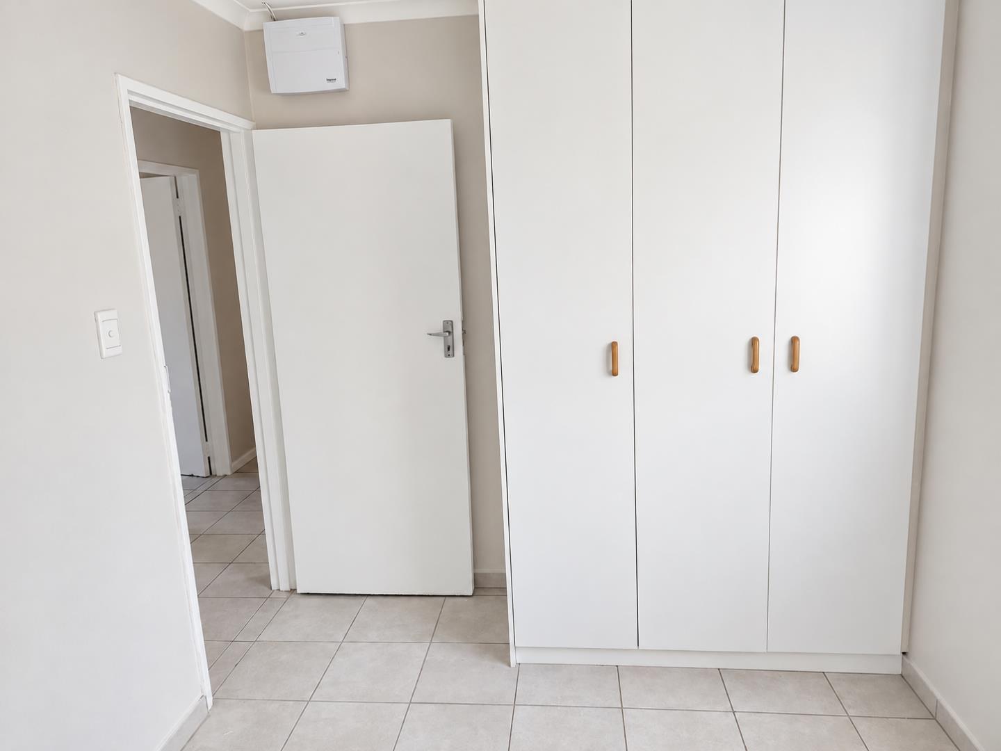 769788_Minimalist_Hallway_with_White_Wardrobe.png