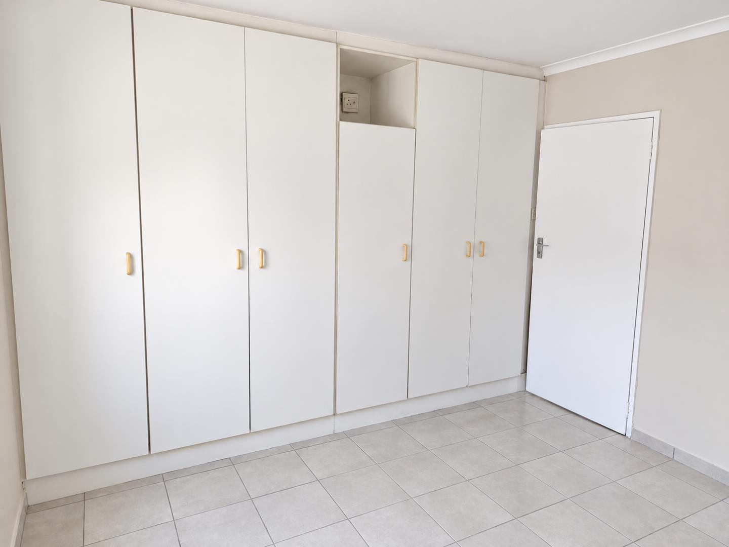 769788_Minimalist_Room_with_Built-In_Wardrobes.png
