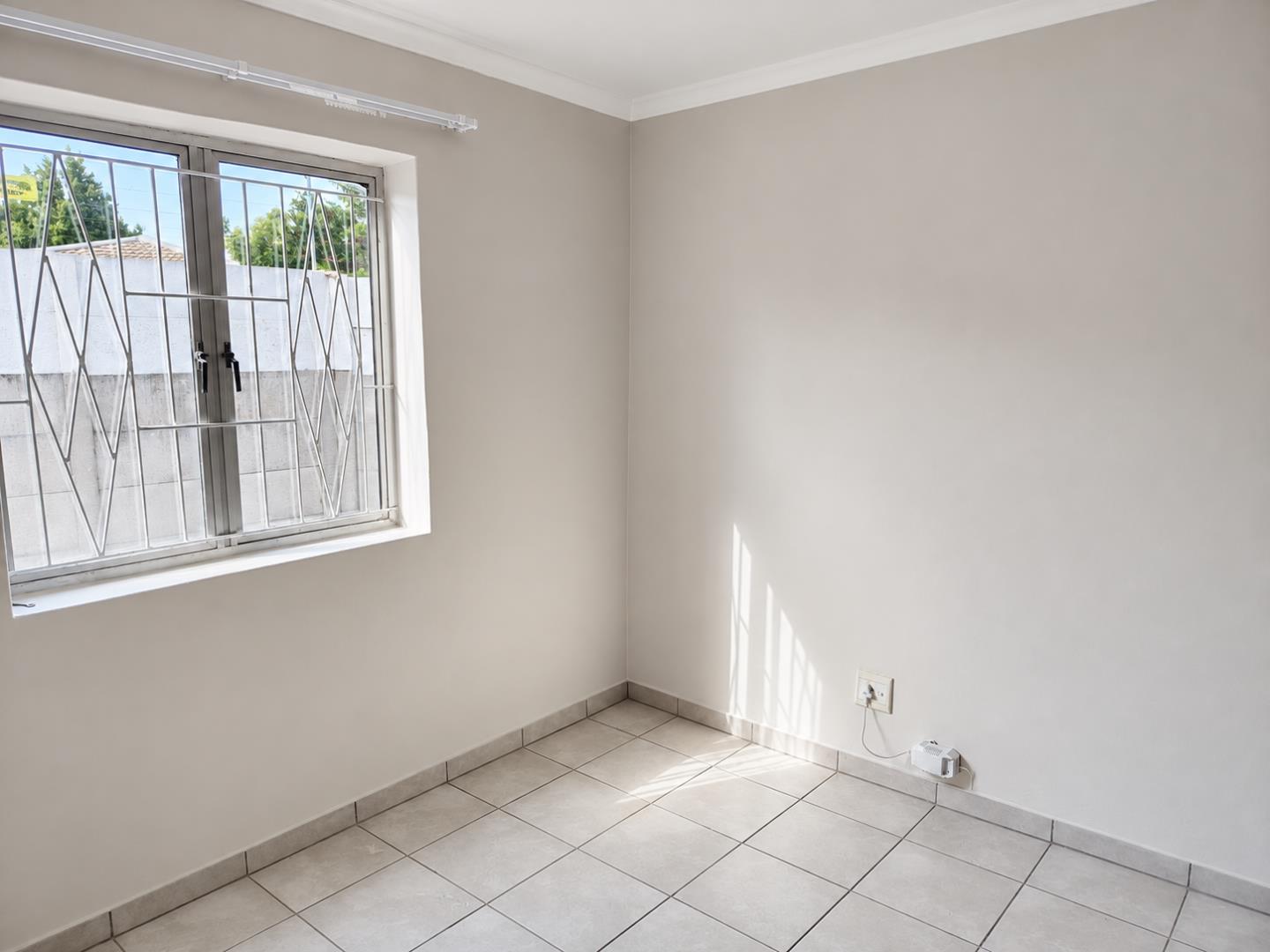 769788_Sunlit_Minimal_Room_with_Barred_Window.png