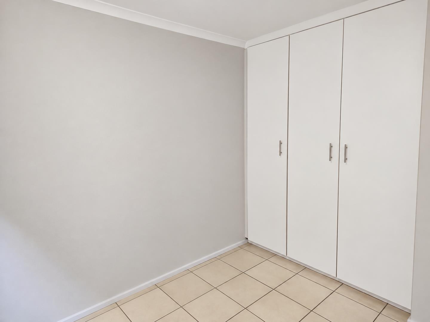 769798_Minimalist_Room_with_Three-Door_Wardrobe.png
