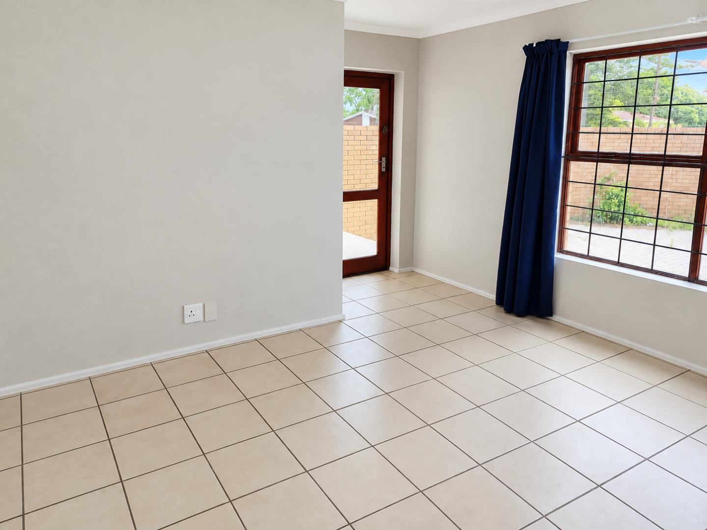 769798_Sunlit_Minimalist_Room_with_Garden_View.png